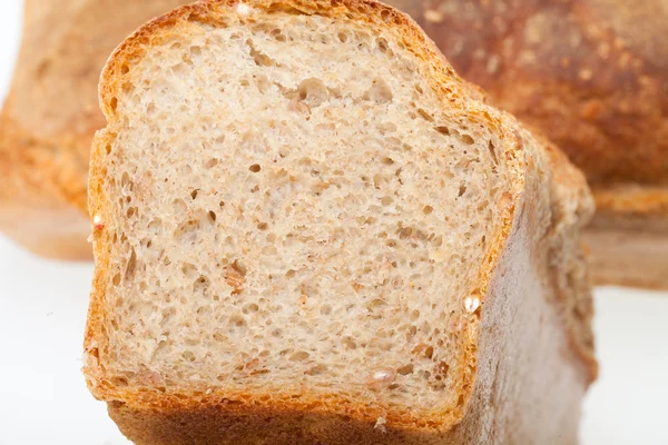 Loaves of bread traditionally roasted. Background. Close up. — Stock Photo, Image