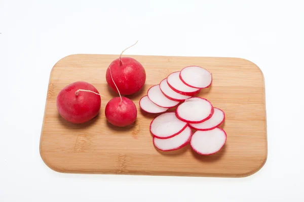 Garden radish on wooden board — Stock Photo, Image