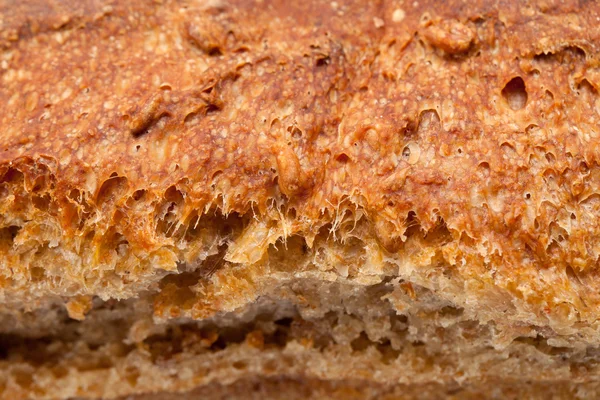 Loaves of bread traditionally roasted. Background. Close up. — Stock Photo, Image