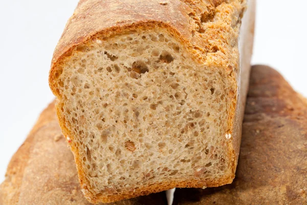 Loaves of bread traditionally roasted. Background. Close up. — Stock Photo, Image