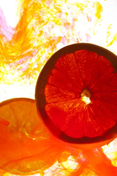 Slice oranges in water — Stock Photo, Image