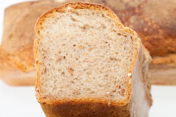 Loaves of bread traditionally roasted. Background. Close up. — Stock Photo, Image