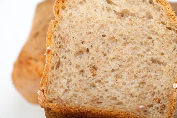 Loaves of bread traditionally roasted. Background. Close up. — Stock Photo, Image