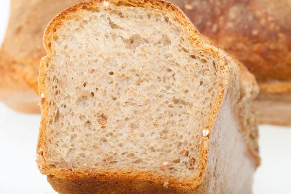 Loaves of bread traditionally roasted. Background. Close up. — Stock Photo, Image