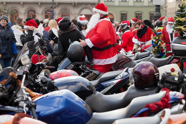 The parade of Santa Clauses on motorcycles around the Main Market Square in Cracow — Stock Photo, Image