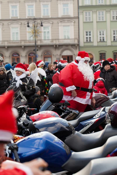 The parade of Santa Clauses on motorcycles around the Main Market Square in Cracow — Stock Photo, Image