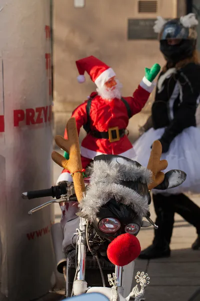 The parade of Santa Clauses on motorcycles around the Main Market Square in Cracow — Stock Photo, Image