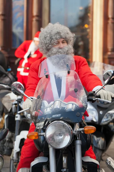 The parade of Santa Clauses on motorcycles around the Main Market Square in Cracow — Stock Photo, Image