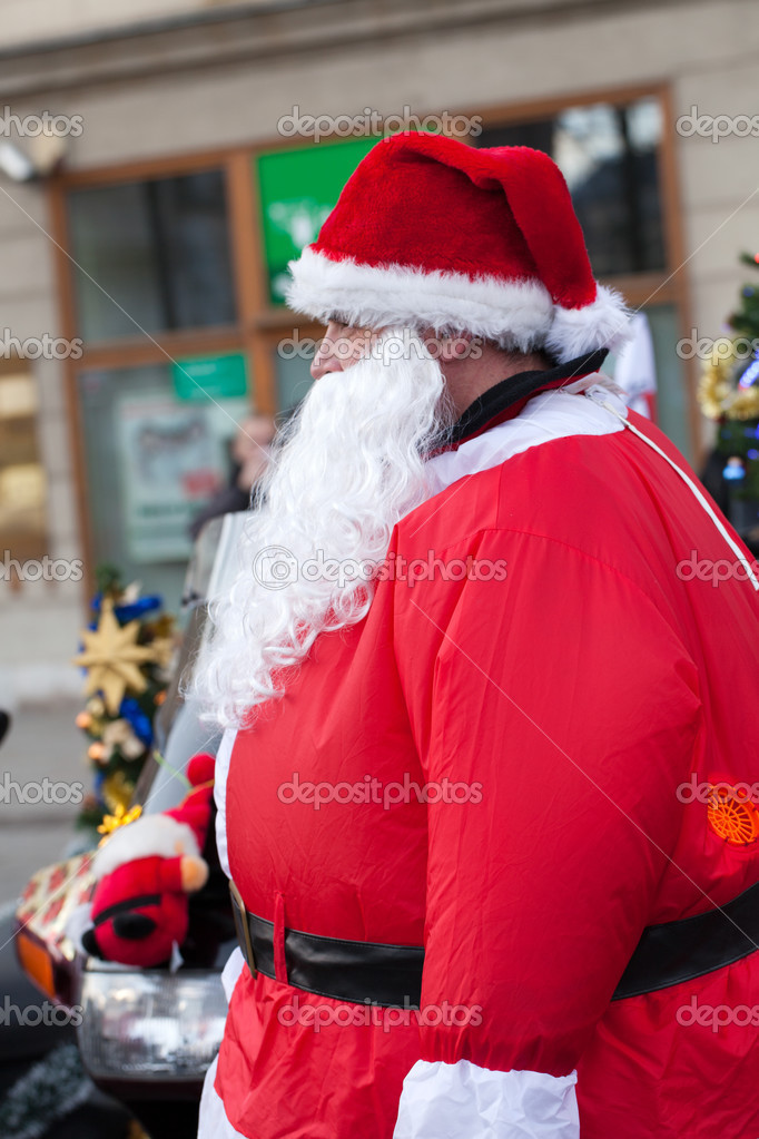Very fat Santa Claus on the street of the city — Stock Photo © wjarek