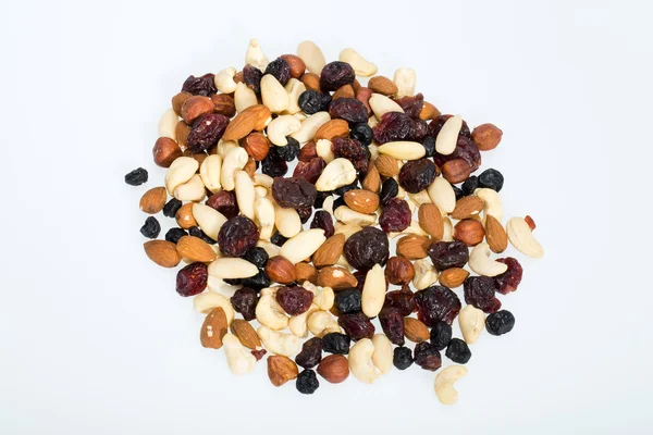 Mixed nuts and dried fruits isolated on white background — Stock Photo, Image