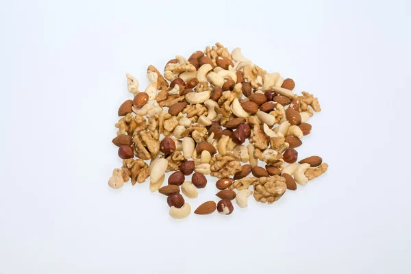 Background of mixed nuts - hazelnuts, walnuts, cashews, pine nuts — Stock Photo, Image