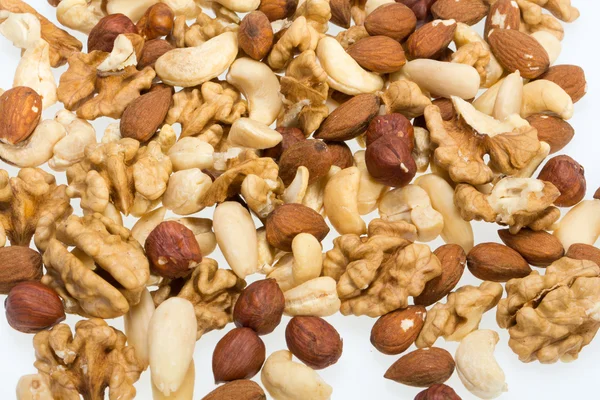 혼합된 견과류-잣, 캐슈, 호두, hazelnuts의 배경 — 스톡 사진