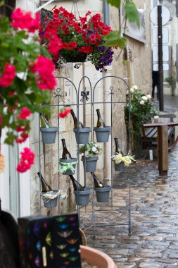 Bottles of wine in flowerpots - most beautiful French flowers clipart