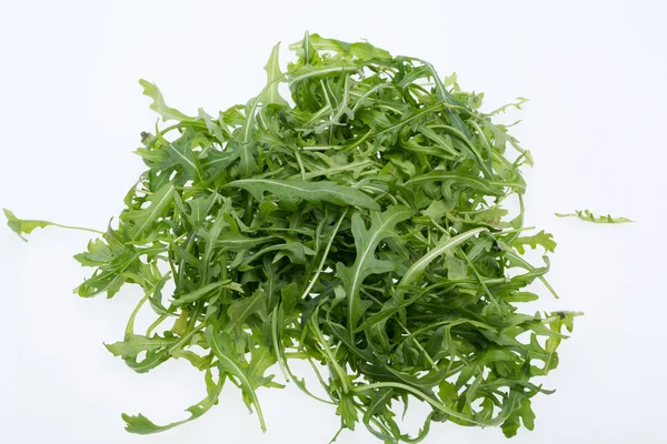 Heap of ruccola leaves isolated on white background — Stock Photo, Image