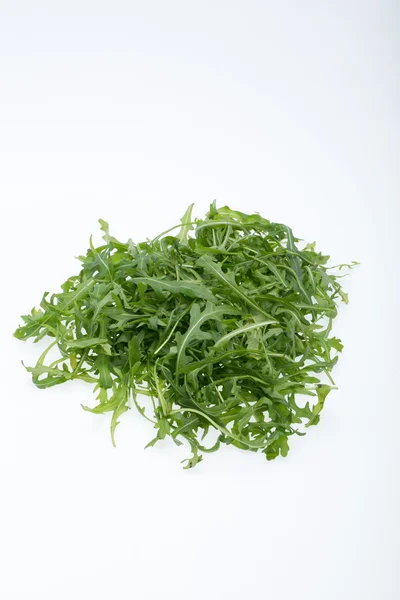 Heap of ruccola leaves isolated on white background — Stock Photo, Image