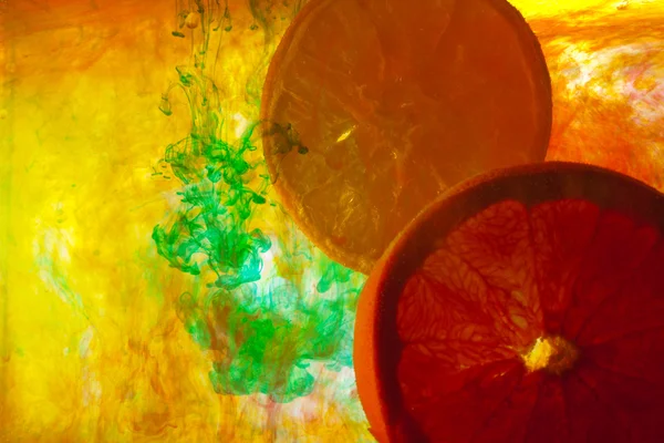 Slice oranges in water — Stock Photo, Image