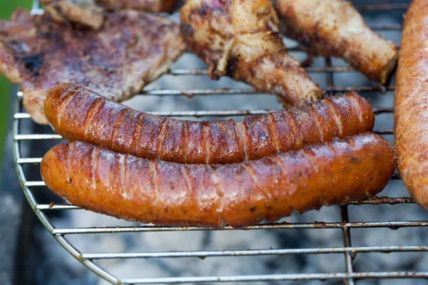 Barbecue with delicious grilled meat on grill — Stock Photo, Image