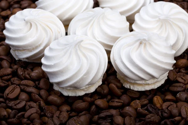 French vanilla meringue cookies and  coffee beans — Stock Photo, Image