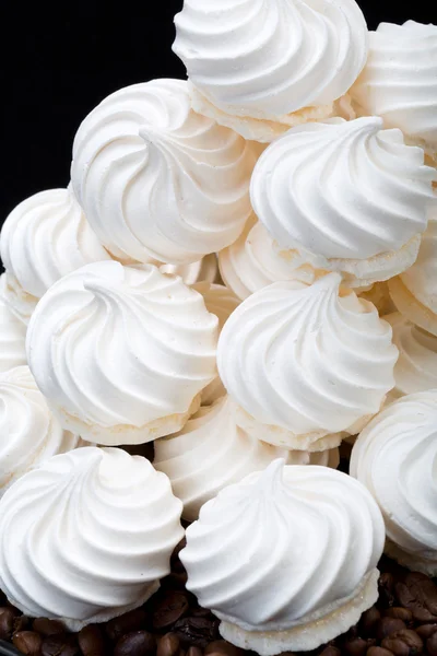 French vanilla meringue cookies and  coffee beans — Stock Photo, Image