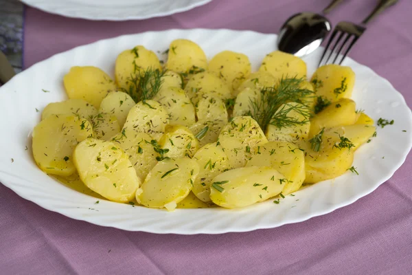 Delicious boiled potatoes with dill and olive — Stock Photo, Image