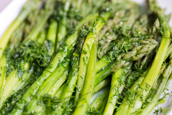 Green asparaguses with the fresh dill — Stock Photo, Image