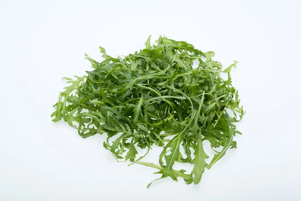 Heap of ruccola leaves isolated on white background — Stock Photo, Image