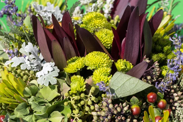 Beautiful bouquets of flowers and herbs — Stock Photo, Image