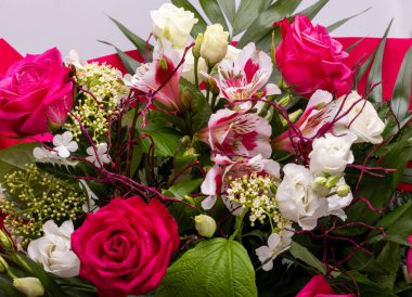 beautiful florist bouquet of roses and freesias
