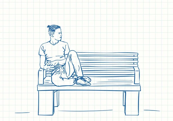 男人坐在长椅上 双脚向上 嬉皮士式发型 蓝笔画在正方形网格笔记本页上 手绘矢量线形插图 — 图库矢量图片