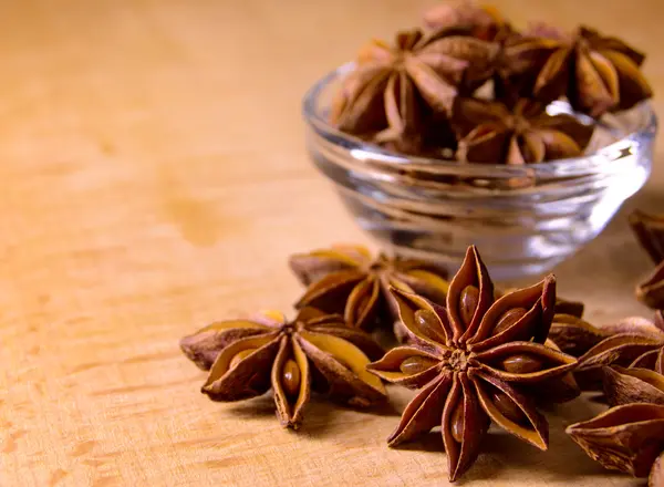 Star Anise in the Glass Bowl on Wooden Table — Stock Photo, Image