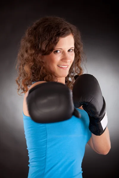 Beautiful sporty woman with box gloves — Stock Photo, Image