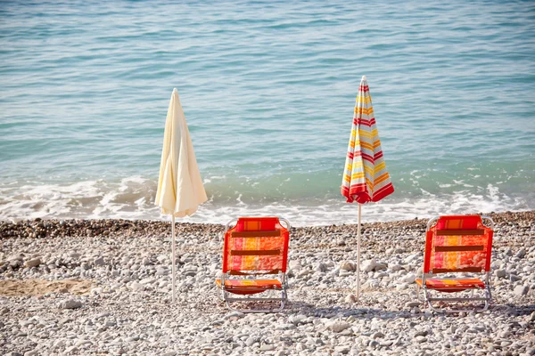 Beach umbrellas with chairs — Stock Photo, Image