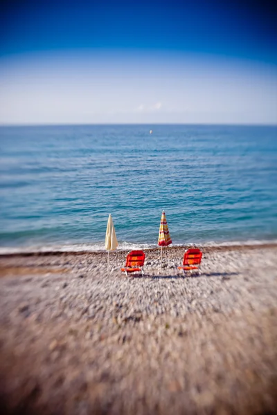 Beach umbrellas with chairs — Stock Photo, Image