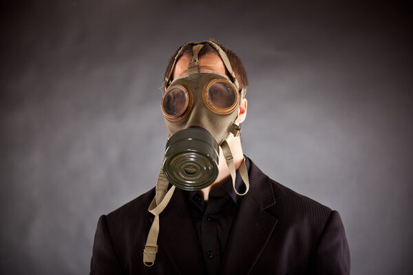 Businessman with gas mask
