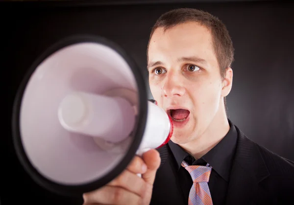 Empresário gritando através de megafone — Fotografia de Stock