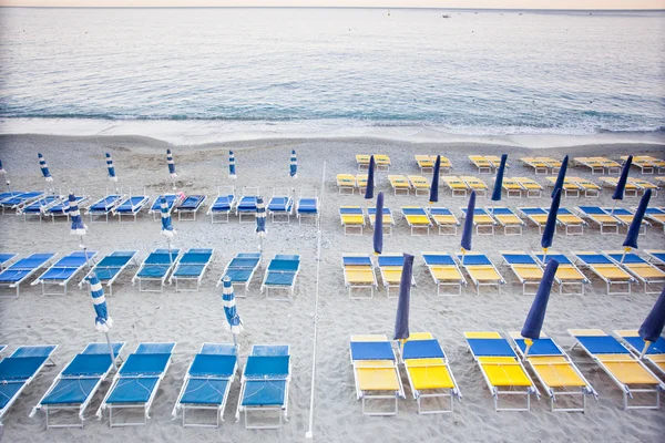 Beach umbrellas with chairs — Stock Photo, Image