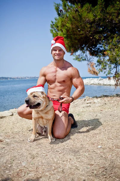 Santa Claus con perro — Foto de Stock