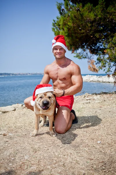 Santa Claus con perro — Foto de Stock