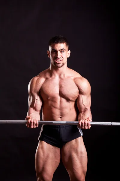Young bodybuilder traininig — Stock Photo, Image