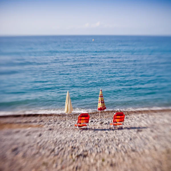 Beach umbrellas with chairs — Stock Photo, Image