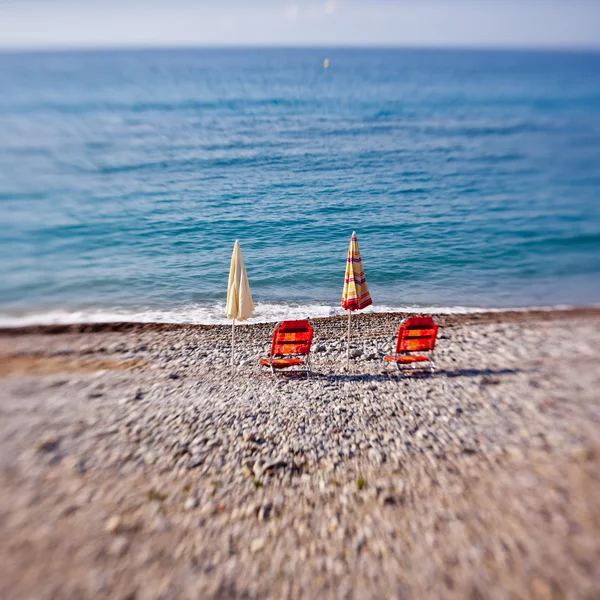 Beach umbrellas with chairs — Stock Photo, Image