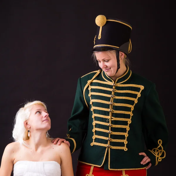 Beautiful bride and hussar — Stock Photo, Image