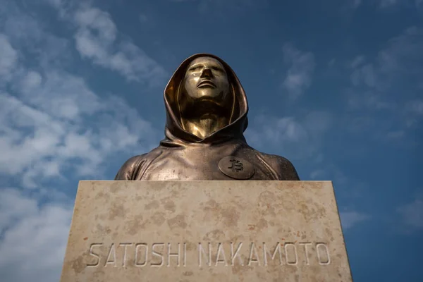 Budapest, Hungary -August 7, .2022:  Portrait of the statue of Satoshi Nakamoto mysterious founder of Bitcoin and Blockchain technology in; created by Reka Gergely and Tamas Gilly.  August 7, .2022 in Budapest, Hungary.