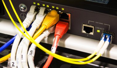 UTP Network cables connected to an Fast-Giga ethernet ports clipart