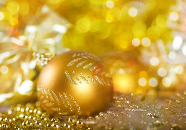 Greeting card with Christmas ball in gold design — Stock Photo, Image