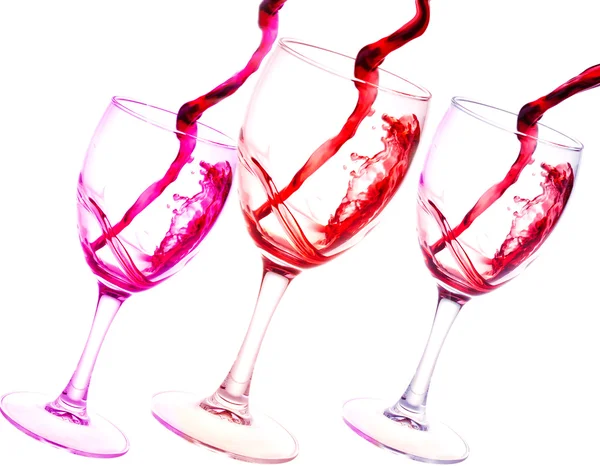 Drei Gläser Rotwein abstrakte Spritzer isoliert auf weißem Hintergrund — Stockfoto