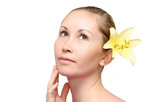 Pretty face of beautiful young woman with lily - white background — Stock Photo, Image