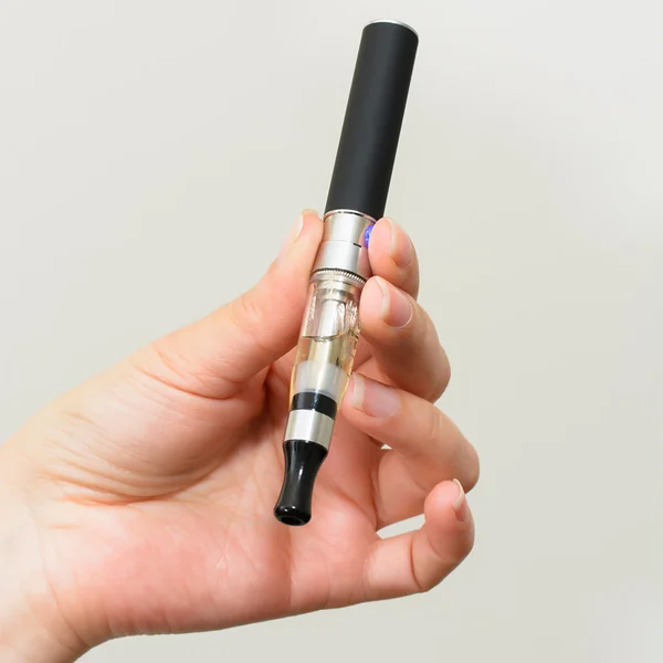 Electronic cigarette in hand — Stock Photo, Image