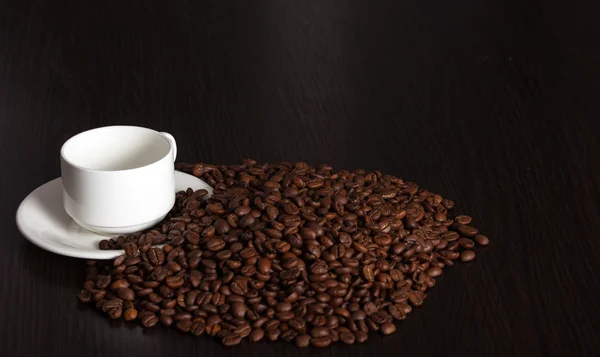 Photo of cup and coffee beans — Stock Photo, Image