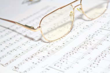 Glasses on music book clipart